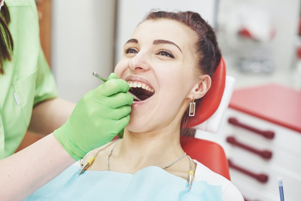 Understanding Bone Loss in the Mouth Signs & Symptoms of Oral Cancer mountainview periodontics periodontics of cherry creek in colorado dr. amy riffel and dr maryanne butler Dentist curing a female patient in the stomatology. Early prevention and oral hygiene concept