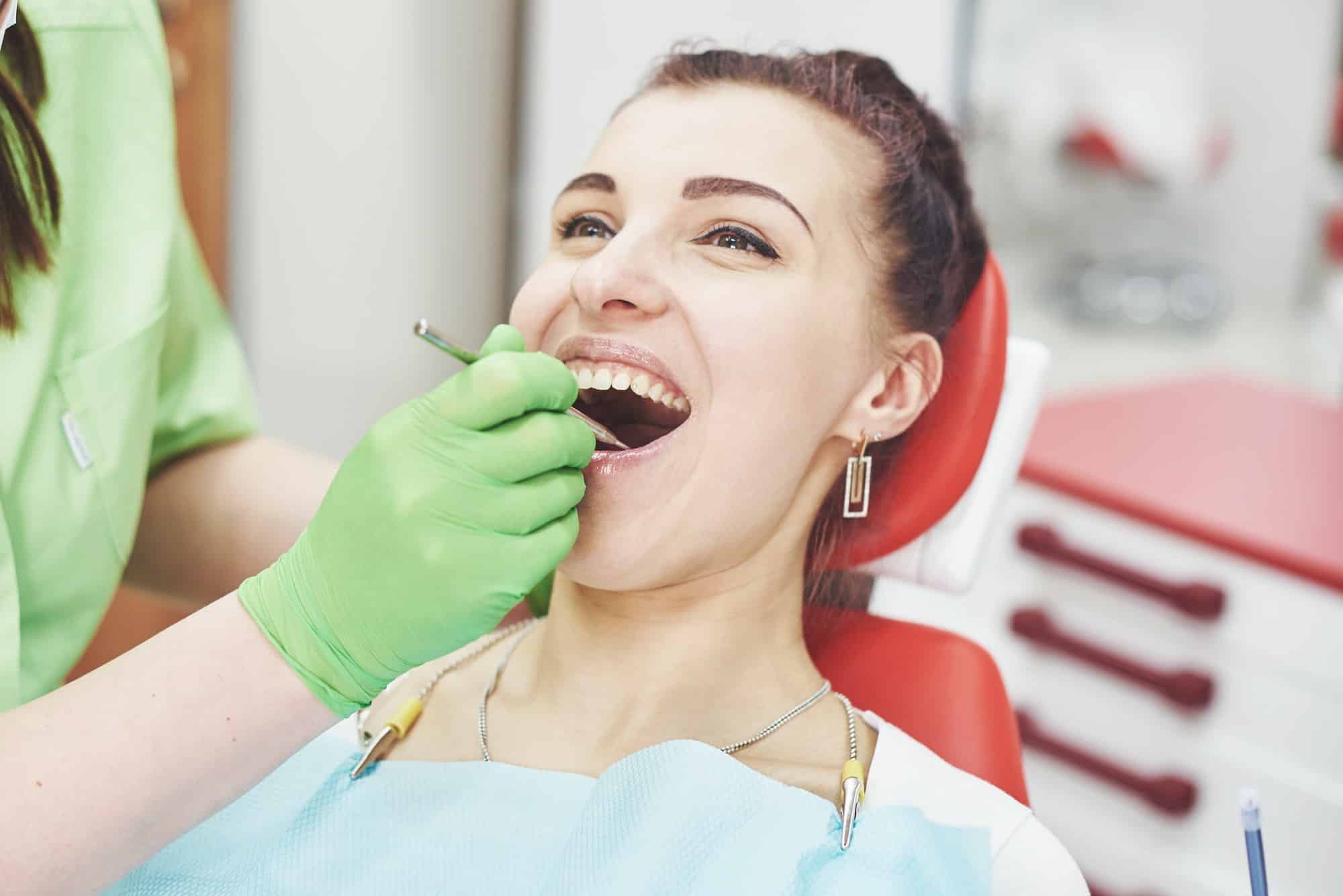 Understanding Bone Loss in the Mouth Signs & Symptoms of Oral Cancer mountainview periodontics periodontics of cherry creek in colorado dr. amy riffel and dr maryanne butler Dentist curing a female patient in the stomatology. Early prevention and oral hygiene concept